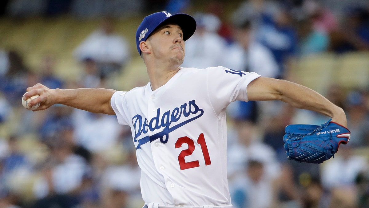 Los Angeles Dodgers starting pitcher Walker Buehler throws to a Washington Nationals batter during the first inning of Game 1 of a baseball National League Divisional Series on Thursday, Oct. 3, 2019, in Los Angeles. (AP Photo/Marcio Jose Sanchez)
