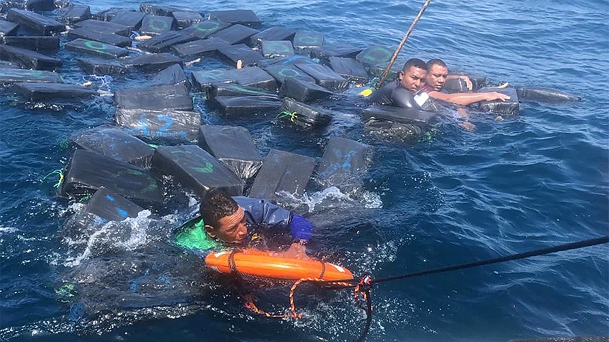 Suspected drug smugglers clung to floating bales of cocaine for hours in  shark-infested waters: cops