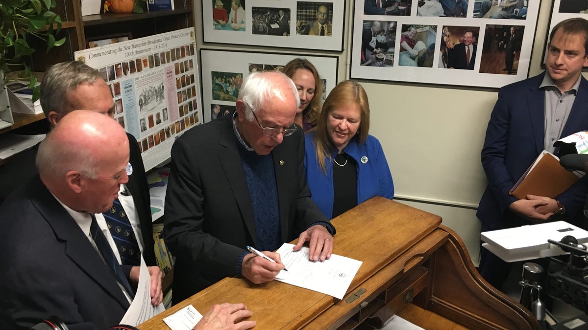 Democratic presidential candidate Sen. Bernie Sanders of Vermont signs the necessary paperwork to file to place his name on New Hampshire's first-in-the-nation presidential primary ballot. At the Statehouse in Concord, N.H., on Oct. 31, 2019
