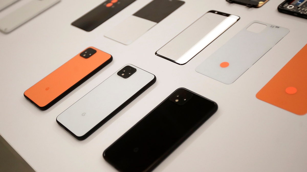 In this Tuesday, Sept. 24, 2019, photo New Pixel 4 phones are displayed at Google in Mountain View, Calif. (AP Photo/Jeff Chiu)