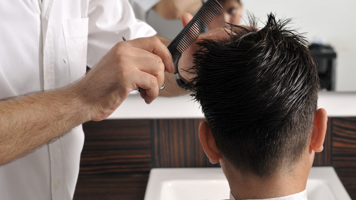 Boy gets hair cut