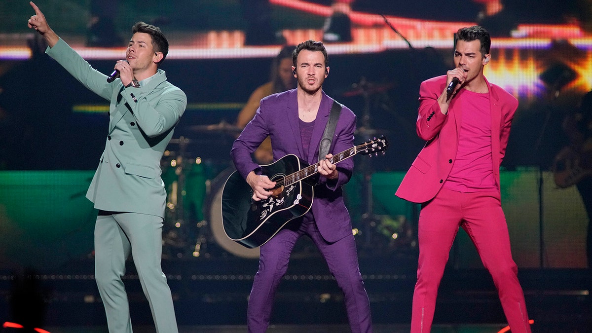 This Sept. 19, 2019 file photo shows Nick Jonas, from left, Kevin Jonas, and Joe Jonas, of the Jonas Brothers, performing during their "Happiness Begins Tour" in Chicago.