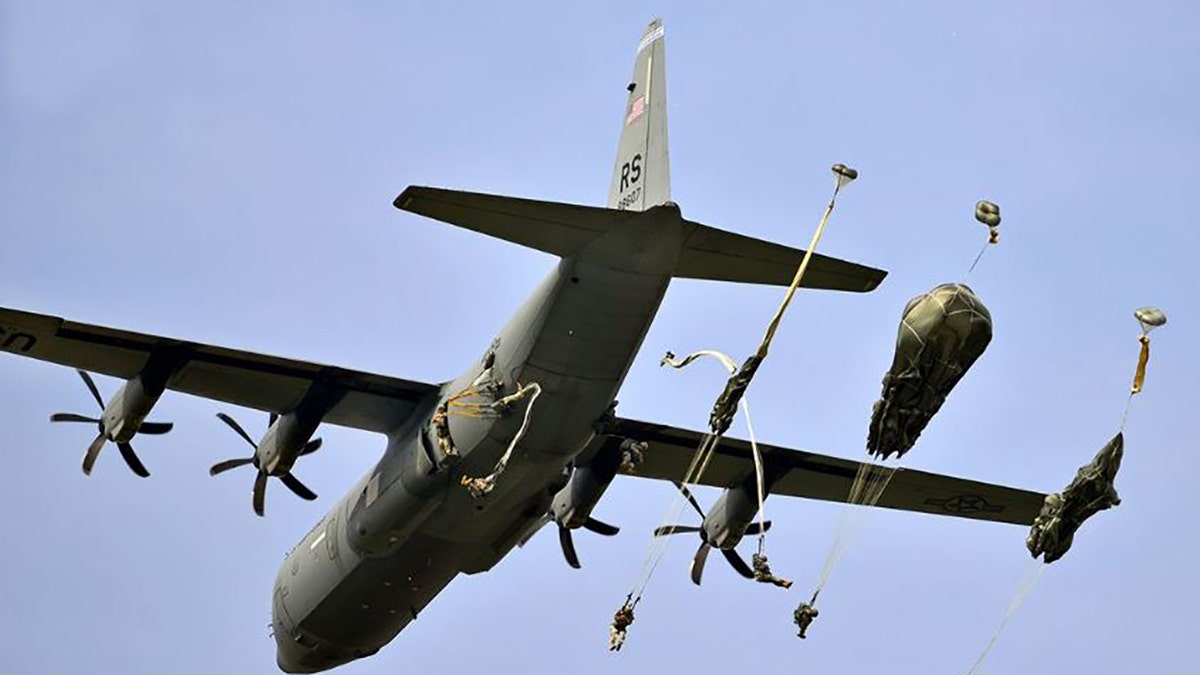 U.S. paratroopers conduct an airborne operation from a C-130 Hercules aircraft on Juliet Drop Zone near Pordenone, Italy, Sept. 24, 2014.