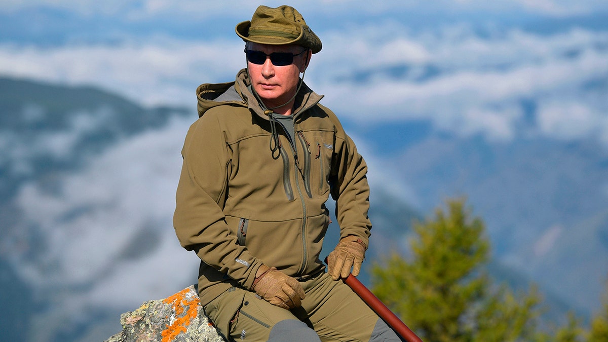 Putin rests on a hill in Siberia during a break from state affairs ahead of his birthday. (Alexei Druzhinin, Sputnik, Kremlin Pool Photo via AP)