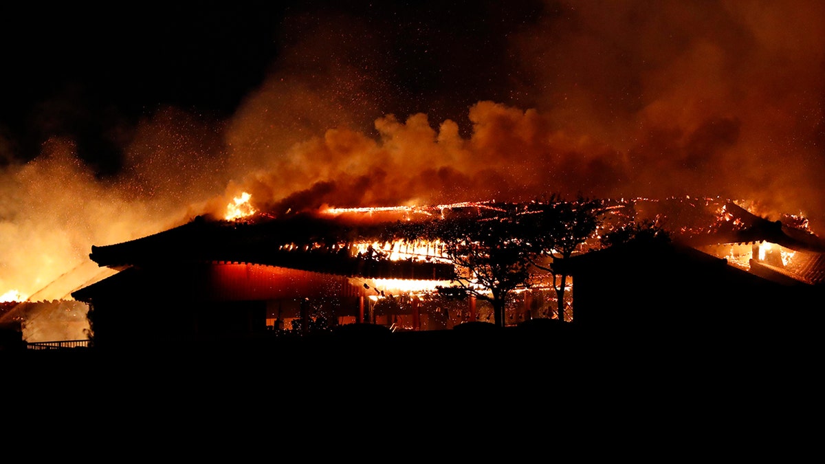 Smoke and flames rise from burning Shuri Castle in Naha, Okinawa. (Jun Hirata/Kyodo News via AP)