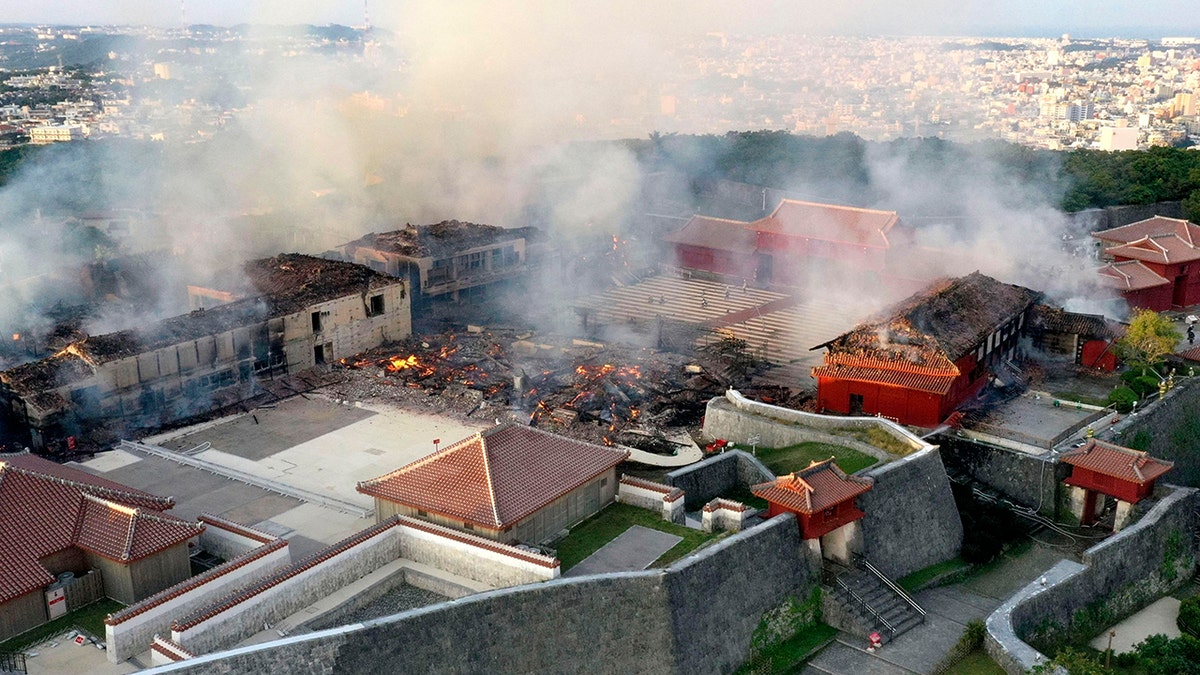 The burnt-out main building of the castle is seen in the center. (Okinawa Times/Kyodo News via AP)