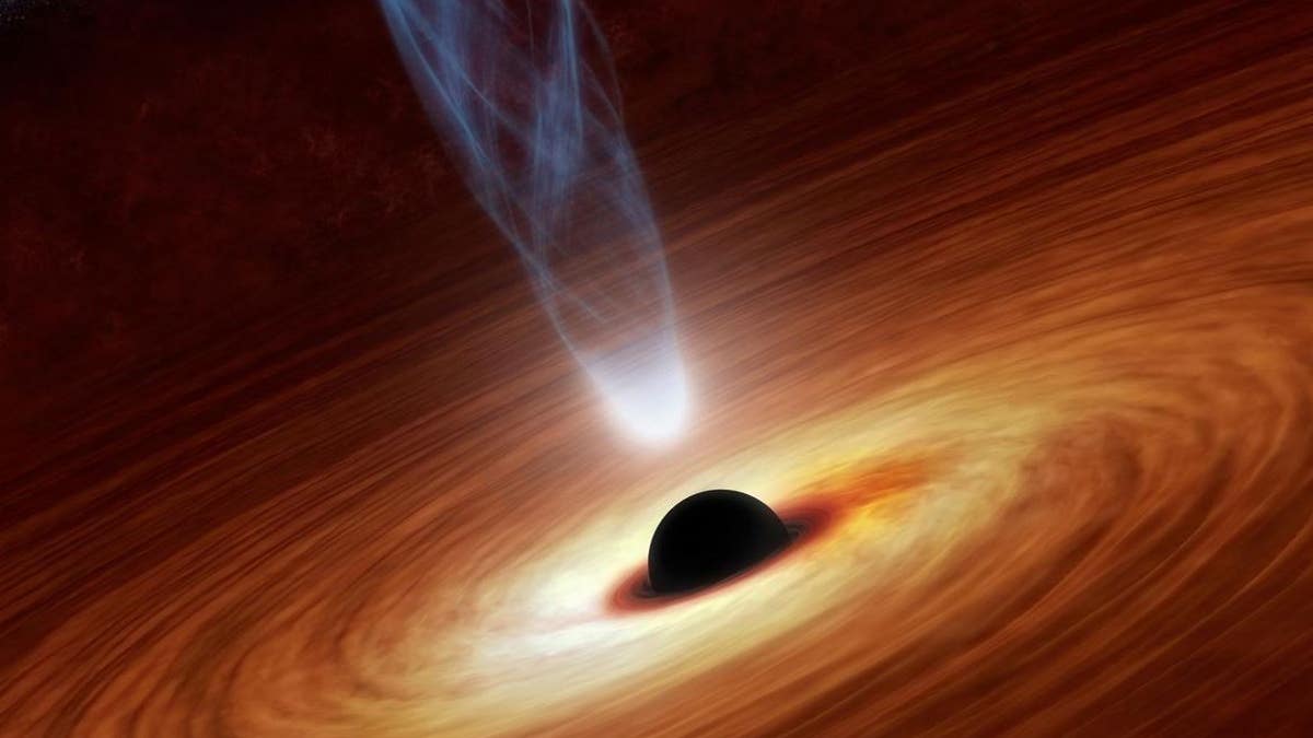 An artist’s concept illustrates a supermassive black hole. A new theoretical study outlines a method that could be used to search for wormholes in the background of supermassive black holes.