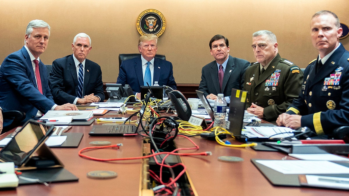 President Donald Trump is joined by from left, national security adviser Robert O'Brien, Vice President Mike Pence, Defense Secretary mark Esper, Joint Chiefs Chairman Gen. Mark Milley and Brig. Gen. Marcus Evans, Deputy Director for Special Operations on the Joint Staff, in the Situation Room as they monitored developments in the U.S. Special Operations forces raid that took out Islamic State leader Abu Bakr al-Baghdadi. (Shealah Craighead/The White House via AP)