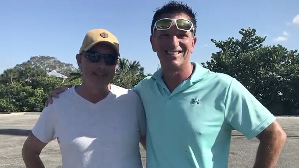 Good Samaritans Rob Goodman, left, and Ed Coster after rescuing a 81-year-old woman who spent 10 hours in the water in a nearly-submerged vehicle in Venice, Fla.