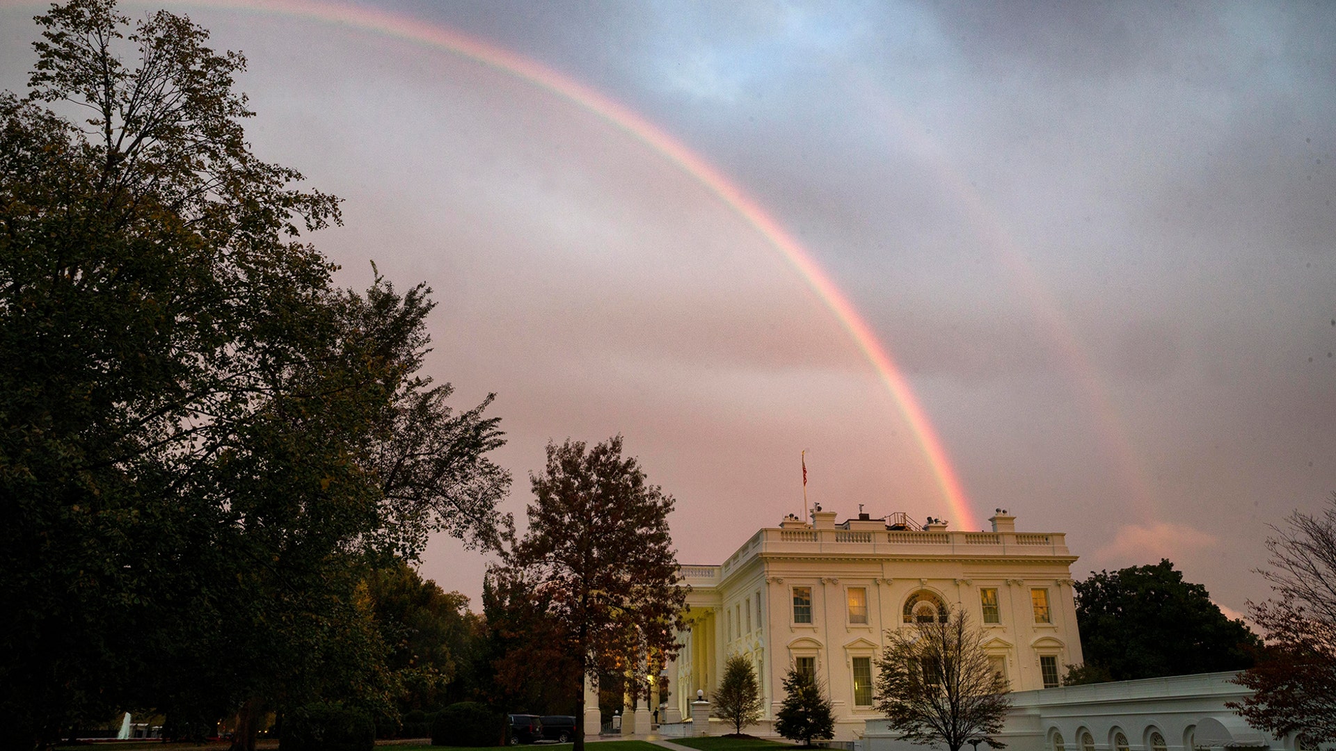 A double rainbow appears in the sky over the White House, in Washington, Oct. 22, 2019. 