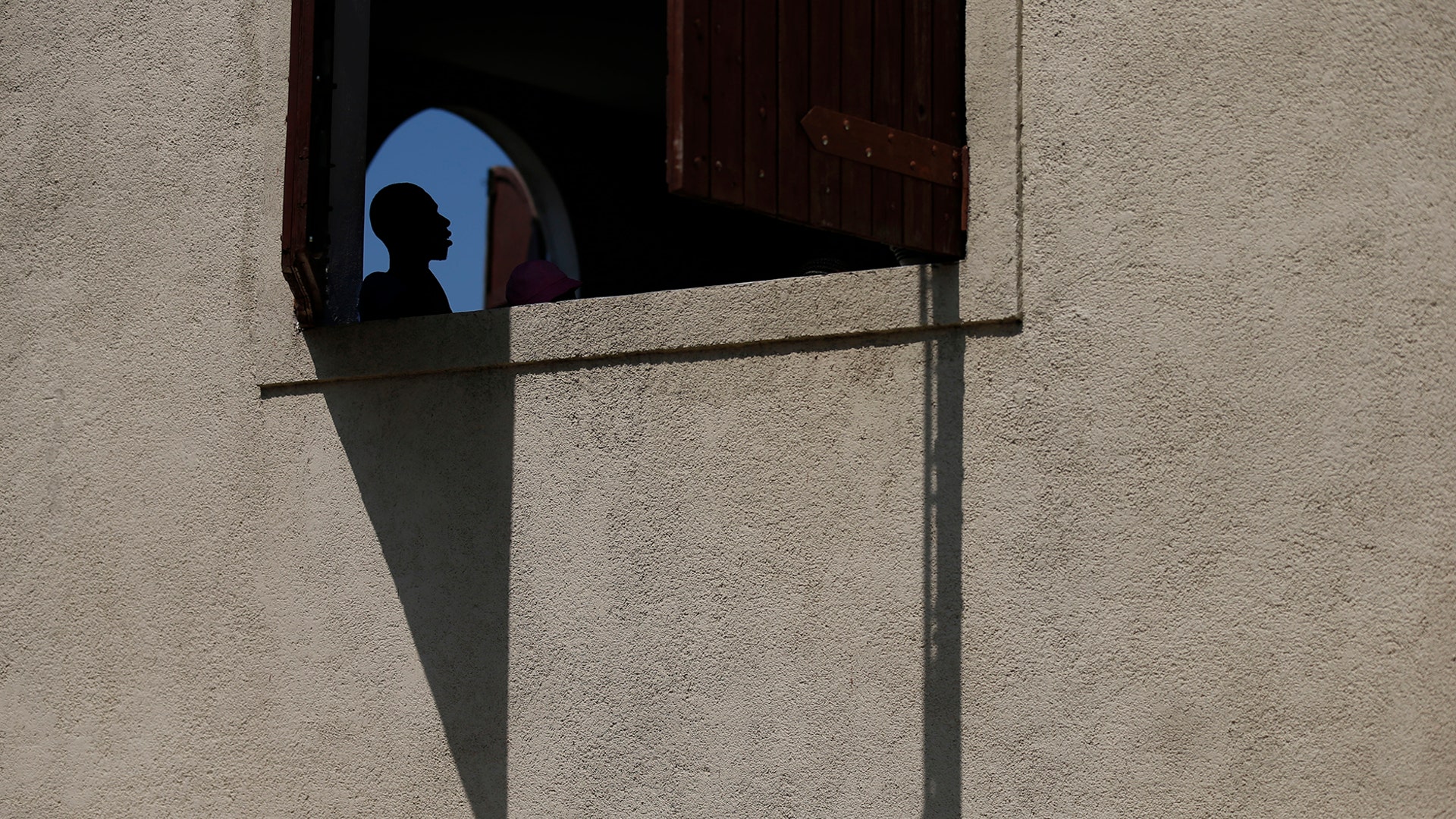 A man attends a Catholic Mass after a march called by religious leaders to show solidarity with the plight of Haitians in Port-au-Prince, Haiti, Oct. 22, 2019. 