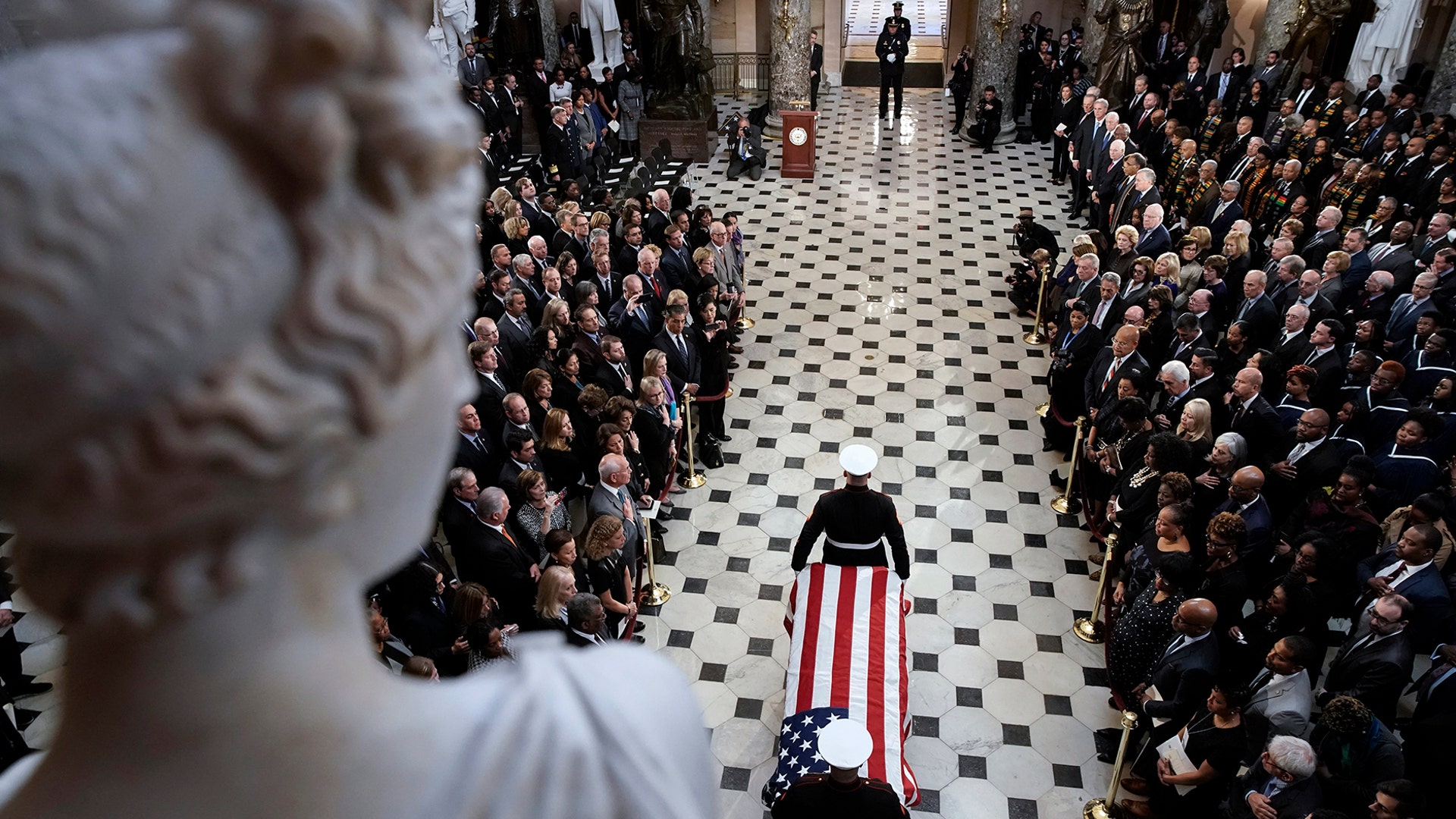 A military honor guard moves the casket Rep. Elijah Cummings into Statuary Hall at the U.S. Capitol in Washington, Oct. 24, 2019. 