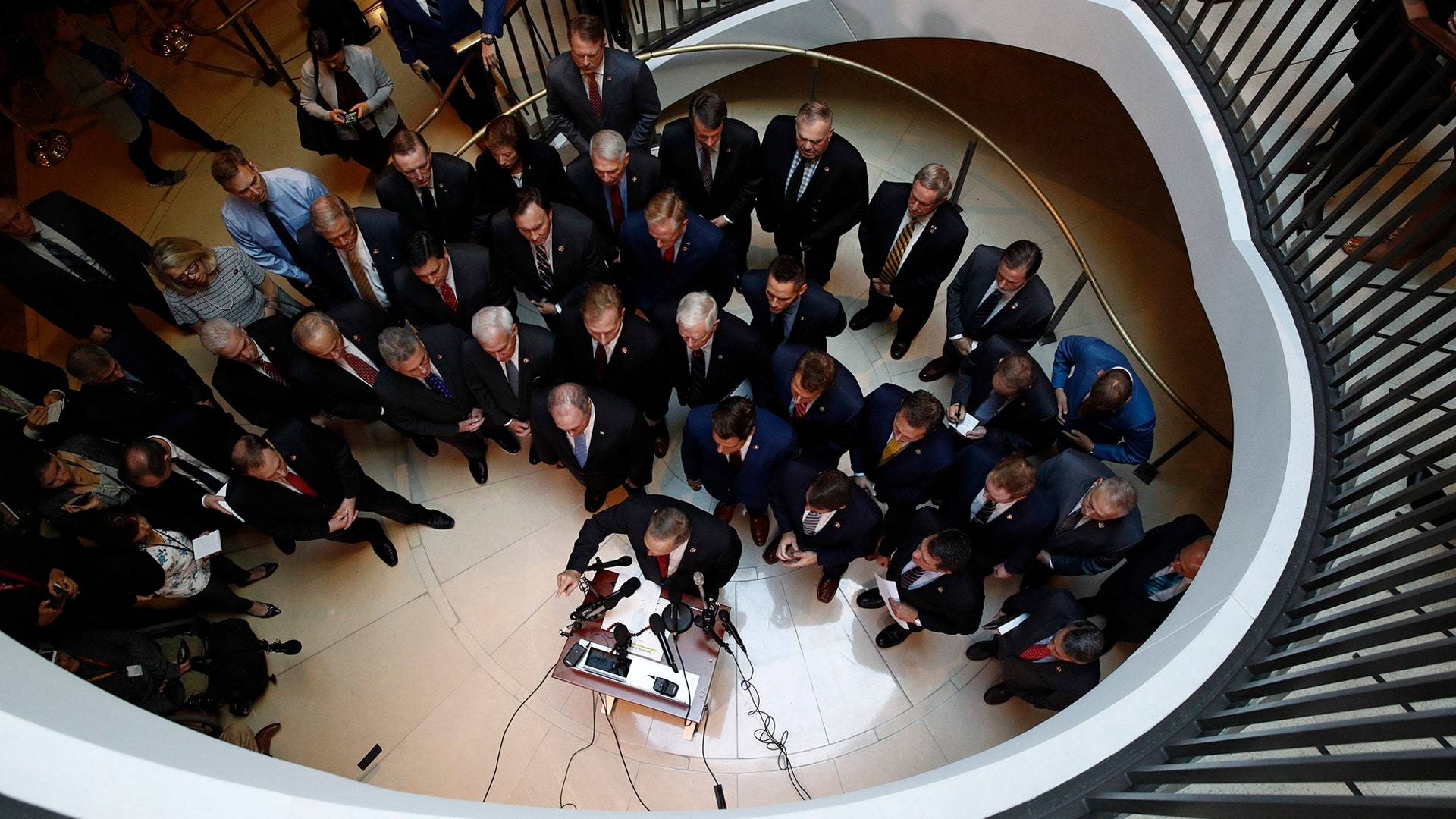 Rep. Andy Biggs speaks at a news conference in front of House Republicans after Deputy Assistant Secretary of Defense Laura Cooper arrived for a closed-door meeting to testify as part of the House impeachment inquiry into President Donald Trump in Washington, Oct. 23, 2019. 