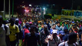 Mexico halts caravan of 2,000 migrants bound for US; critics call roundup a 'human hunt'