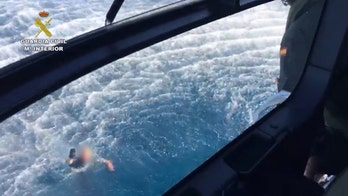 Suspected drug traffickers rescue Spanish police officers after collision at sea during high-speed chase