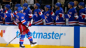 Rangers player wipes out on ice before hockey game