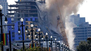New Orleans implodes damaged cranes on partially collapsed Hard Rock hotel