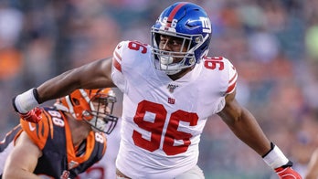 New York Giants' Kareem Martin delivers Super Bowl tickets to volunteer football coach with Down syndrome