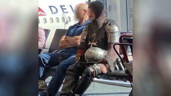 Man wears full suit of armor to airport