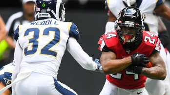 Falcons' Devonta Freeman ejected for throwing punch at Rams' Aaron Donald, sparking kerfuffle