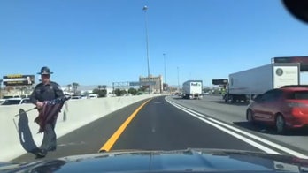 Nevada police officer saves American flag from side of Las Vegas highway