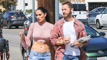 Nikki Bella shows off toned stomach with Artem Chigvintsev