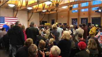 Biden interrupted at New Hampshire campaign stop by climate change activists