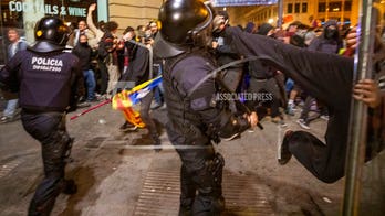 Barcelona pro-independence protesters clash with police after massive peaceful rally