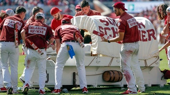 Oklahoma 'Sooner Schooner' horse-drawn wagon flips during game
