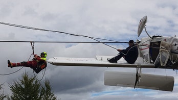Small plane gets caught in ski lift cables after crash in Italian Alps