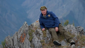 Russian President Vladimir Putin’s birthday hike includes usual staged photos, though he keeps his shirt on