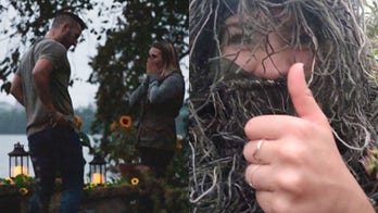 Woman disguises herself as bush to photograph sister's engagement