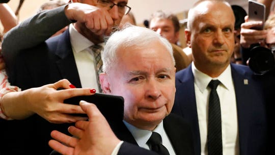 Poland’s ruling conservative party declares victory for another four years