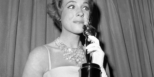 This April 6, 1965 file photo shows actress Julie Andrews holding her best actress Oscar for
