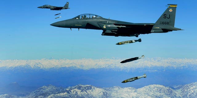U.S. Air Force F-15E Strike Eagles drop 2,000-pound munitions on a cave in eastern Afghanistan in 2009. (U.S. Air Force/Staff Sgt. Michael B. Keller)