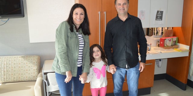 Sophia and her parents shortly before they left the hospital.