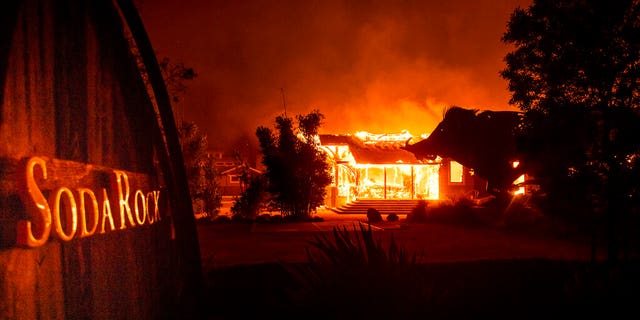 Flames from the Kincade Fire consuming Soda Rock Winery on Sunday in Healdsburg, Calif.