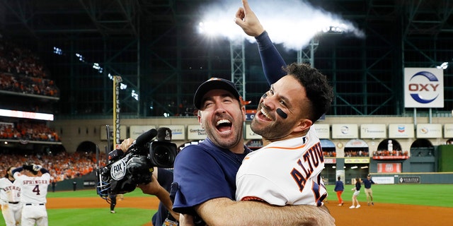 Houston Astros' Jose Altuve, right, and starting pitcher Justin Verlander celebrate after winning Game 6 of baseball's American League Championship Series against the New York Yankees Saturday, Oct. 19, 2019, in Houston. The Astros won 6-4 to win the series 4-2. (Associated Press)