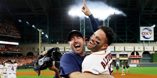 Houston Astros' Jose Altuve, right, and starting pitcher Justin Verlander celebrate after winning Game 6 of baseball's American League Championship Series against the New York Yankees Saturday, Oct. 19, 2019, in Houston. The Astros won 6-4 to win the series 4-2. (Associated Press)