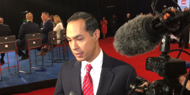 Democratic presidential candidate Julian Castro speaks with reporters in the spin room following the fourth round Democratic primary debate in Westerville, Ohio on Oct. 15, 2019