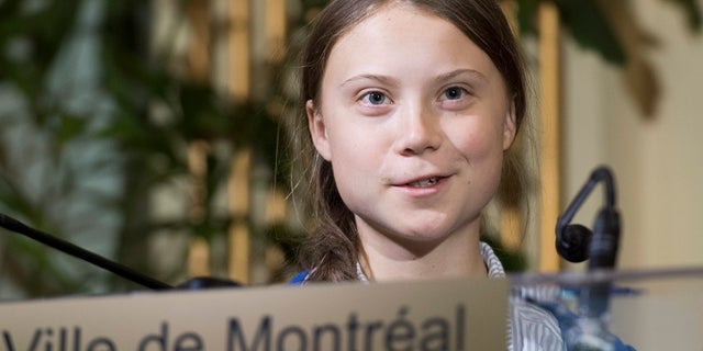 Swedish climate activist Greta Thunberg speaks to reporters after receiving the key to the city of Montreal during a ceremony in Montreal last month. (Graham Hughes/The Canadian Press via AP)