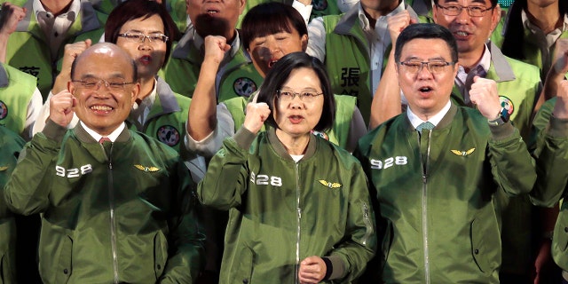 Taiwan President and presidential candidate of Democratic Progressive Party (DPP) in the 2020 elections Tsai Ing-wen, center, cheers with party members during the party's anniversary in Taipei, Taiwan, Saturday, Sept. 28, 2019. (AP Photo/Chiang Ying-ying)