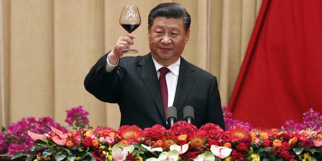 Chinese President Xi Jinping makes a toast after delivering his speech at a dinner marking the 70th anniversary of the founding of the People's Republic of China at the Great Hall of the People in Beijing, Monday, Sept. 30, 2019. President Donald Trump said Thursday that he has not asked Xi to investigate the Biden family's business dealings, but that, "it's certainly something we could start thinking about."