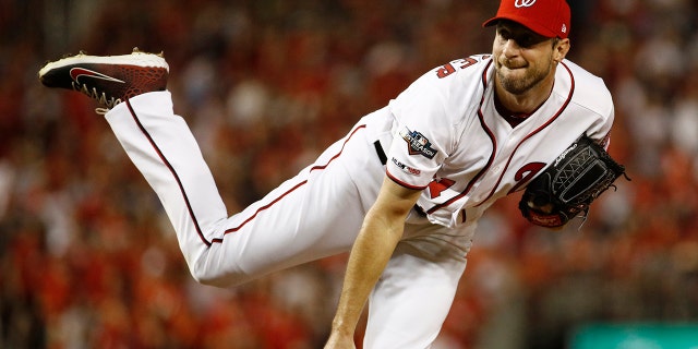 Washington Nationals starting pitcher Max Scherzer follows through on a pitch to the Milwaukee Brewers in the first inning of a National League wild card baseball game, Tuesday, Oct. 1, 2019, in Washington. (Associated Press)