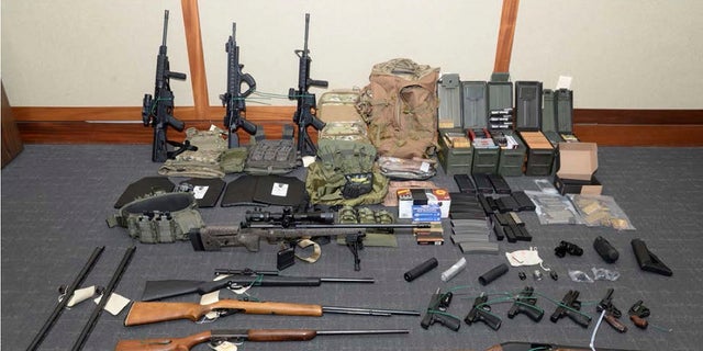 A photo of firearms and ammunition found in Hasson's Silver Spring, Md. home. (Maryland U.S. District Attorney's Office via AP, File)