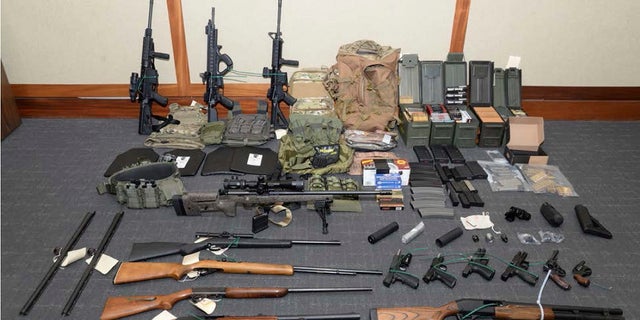 A photo of firearms and ammunition found in Hasson's Silver Spring, Md. home. (Maryland U.S. District Attorney's Office via AP, File)