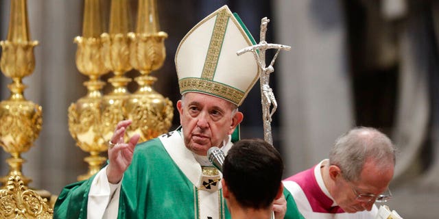 Pope Francis delivers his blessing as he celebrates an opening Mass for the Amazon synod, in St. Peter's Basilica, at the Vatican, Oct. 6, 2019.