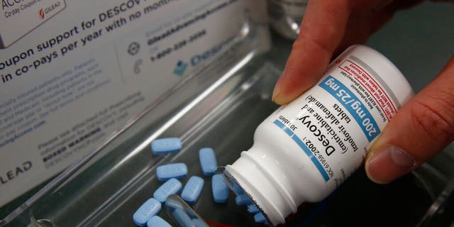 Pharmacist Clint Hopkins displays the HIV prevention drug Descovy, at Pucci's Pharmacy in Sacramento, Calif., Monday, Oct. 7, 2019.