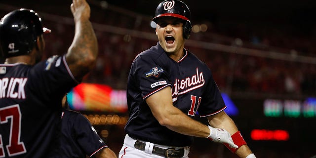 Washington Nationals first baseman Ryan Zimmerman celebrating his three-run homer off Los Angeles Dodgers relief pitcher Pedro Baez (52) with teammate Howie Kendrick in the fifth inning in Game 4 of a baseball National League Division Series, Monday, Oct. 7, 2019, in Washington.(AP Photo/Alex Brandon)
