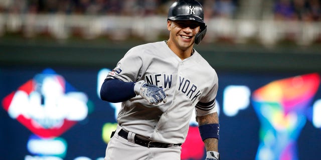 New York Yankees' Gleyber Torres celebrates as he runs the bases after hitting a home run during the second inning in Game 3 of a baseball American League Division Series against the Minnesota Twins, Monday, Oct. 7, 2019, in Minneapolis. (AP Photo/Bruce Kluckhohn)